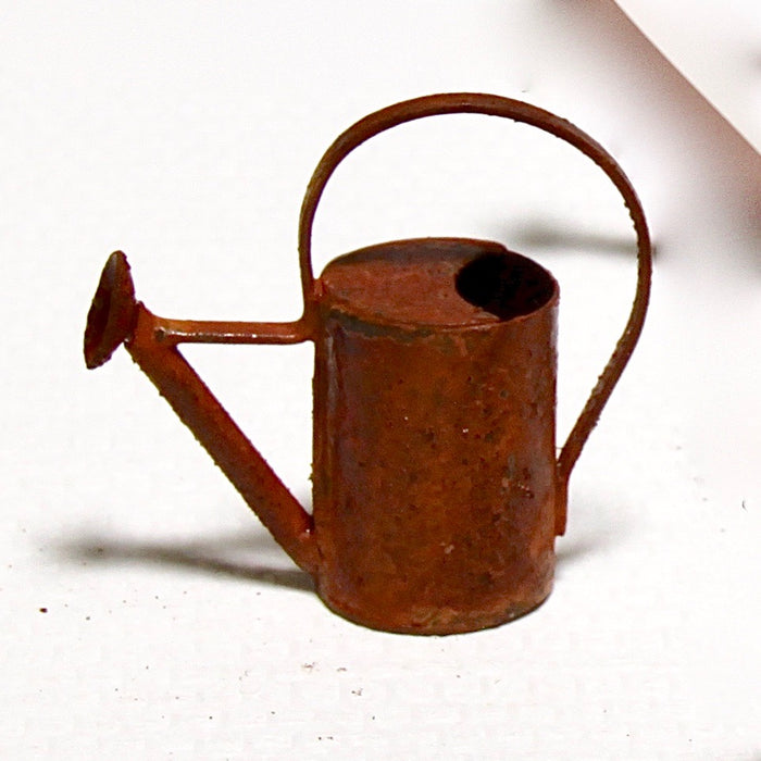 A watering can, rusty, small