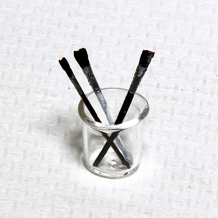 Brushes in a mouth-blown glass jar