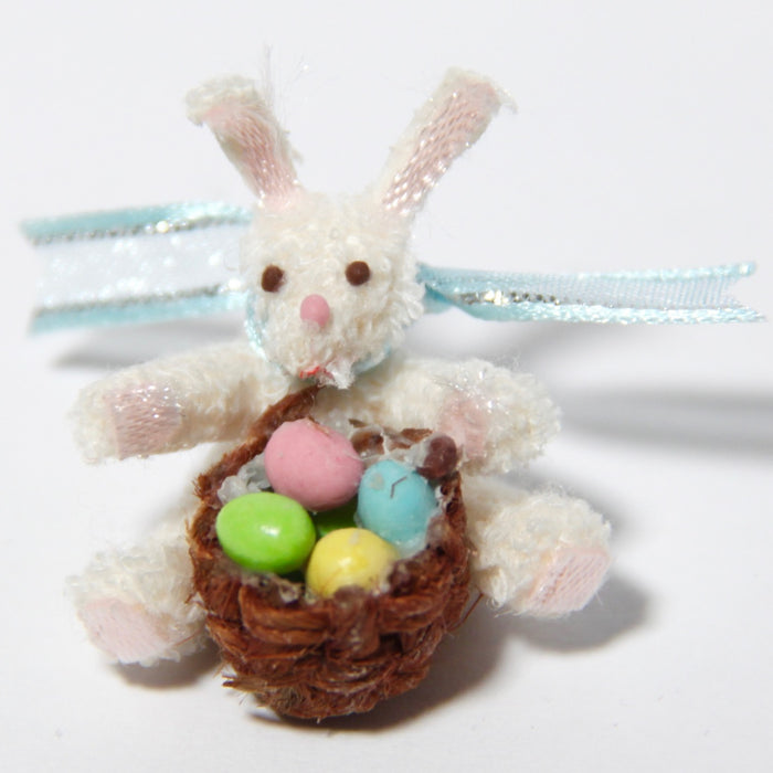 Sitting rabbit, Easter eggs in a basket