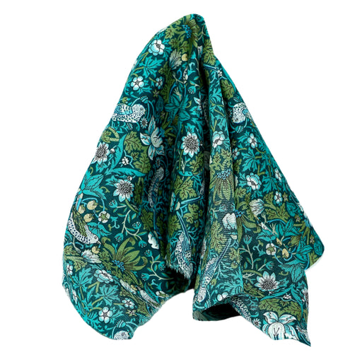 Pienikuvioinen vihreä kangas.