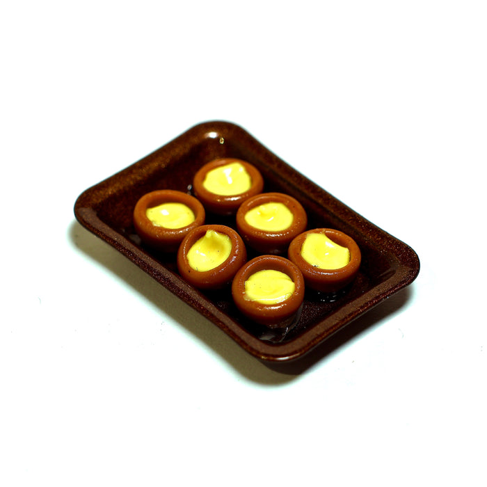 Dallaspullat uunipellillä