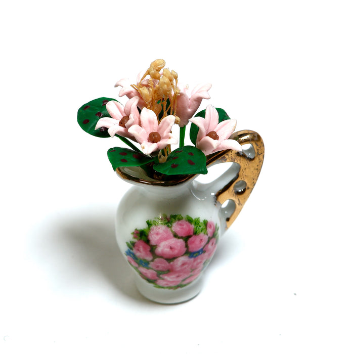 Posliinikannu ja vaaleanpunaisia kukkia, Reutter