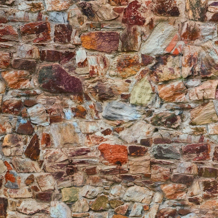 Stone wall, mottled red clay