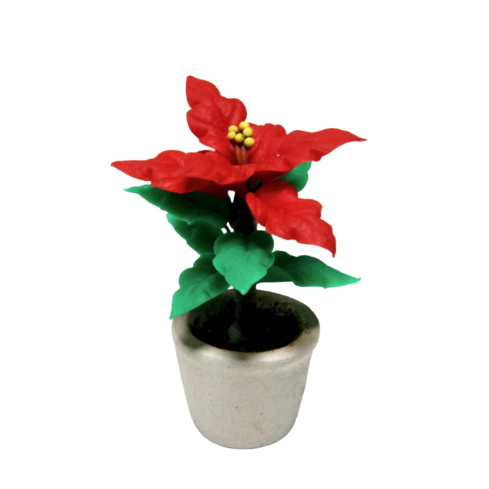 Joulutähti nukkekodin jouluun.