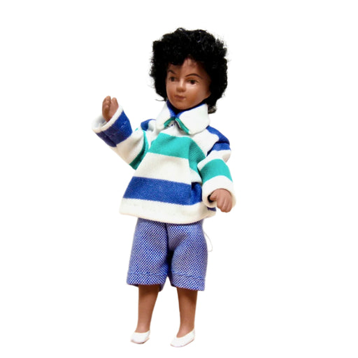 Tummaihoinen nukkekodin nukke.