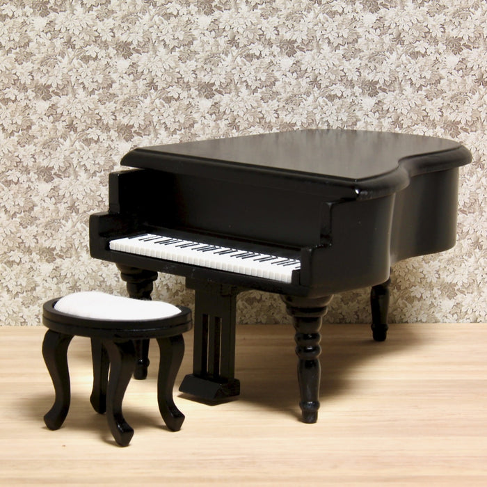 Grand piano and upholstered stool, black