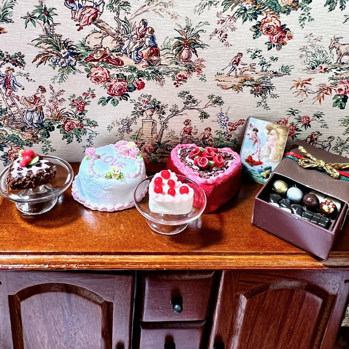 Heart chocolate cake in a serving dish, small, with a top