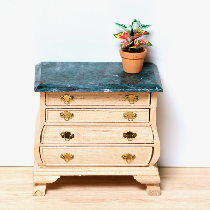 Chest of drawers, marble top, finished in wood