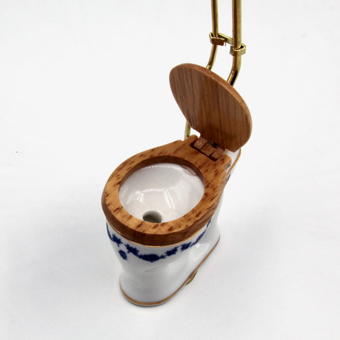 Old-time toilet bowl, tall, blue bow