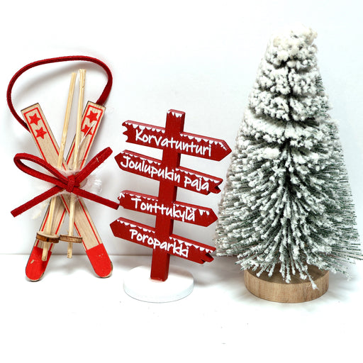 Jouluminiatyyrit tontun oveen.