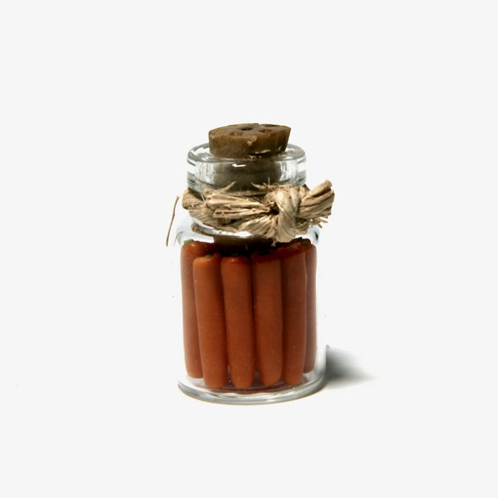 Canned carrots in a glass jar