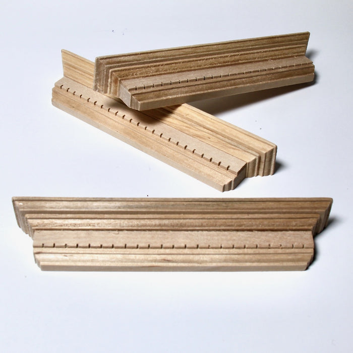 Pediment with decorative cutouts, 3 pieces, finished in wood