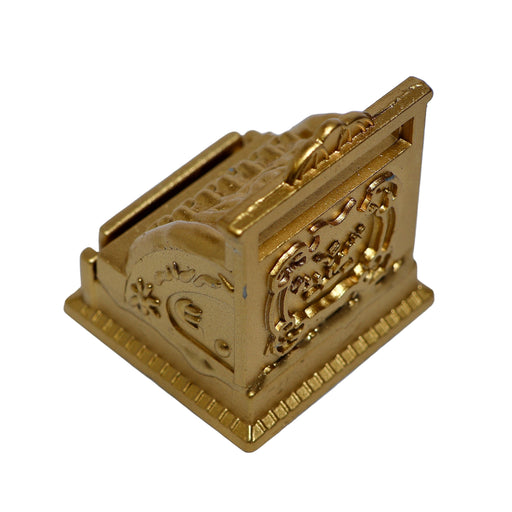 Koristeellinen assakone nukkekotiin.