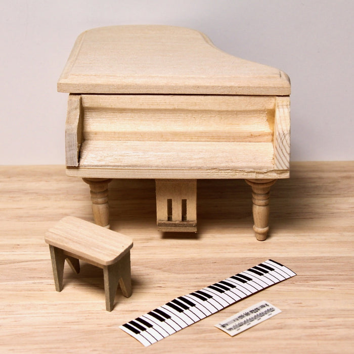 Grand piano and stool, finished in wood