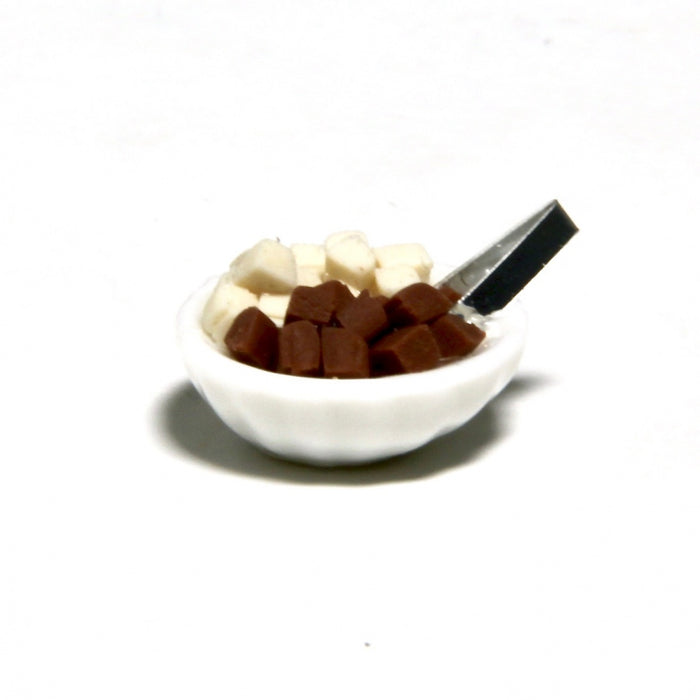 Granulated sugar and sugar tongs in a bowl