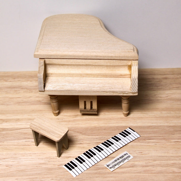 Grand piano and stool, finished in wood