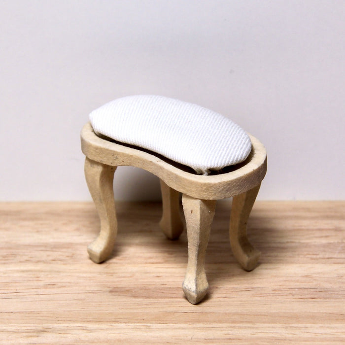 Stool, upholstered, finished in wood