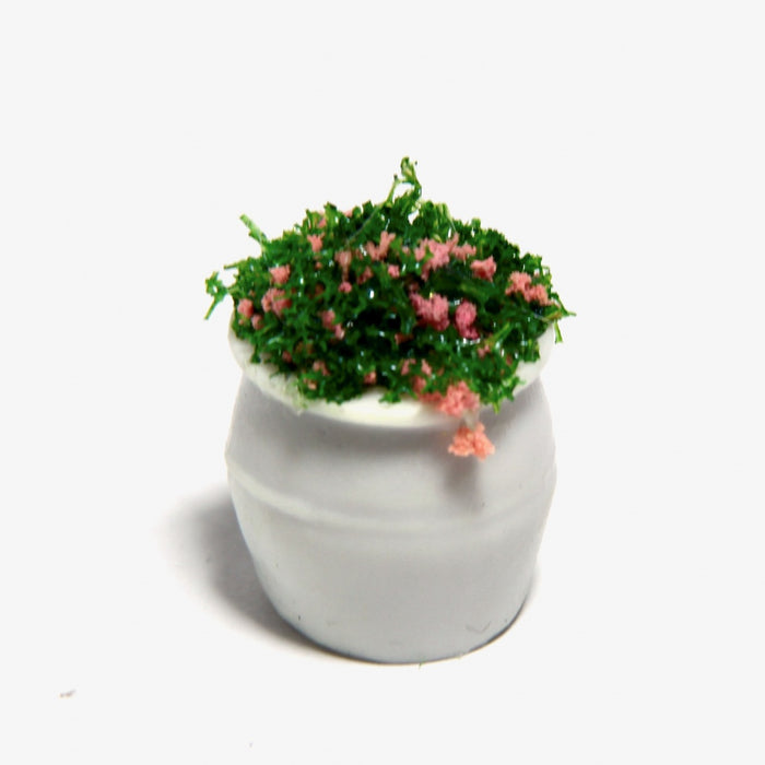 Pink flower in a round pot, very small