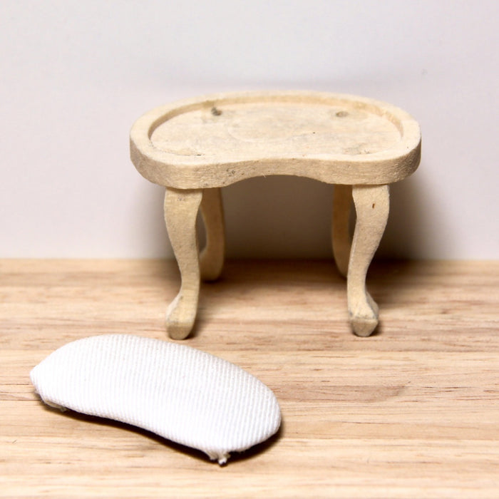 Stool, upholstered, finished in wood